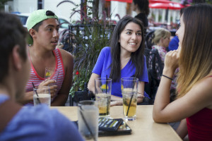 millennials having drinks on a patio