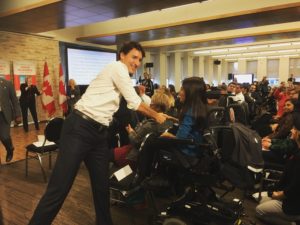 Justin Trudeau shakes hands with Maayan Ziv