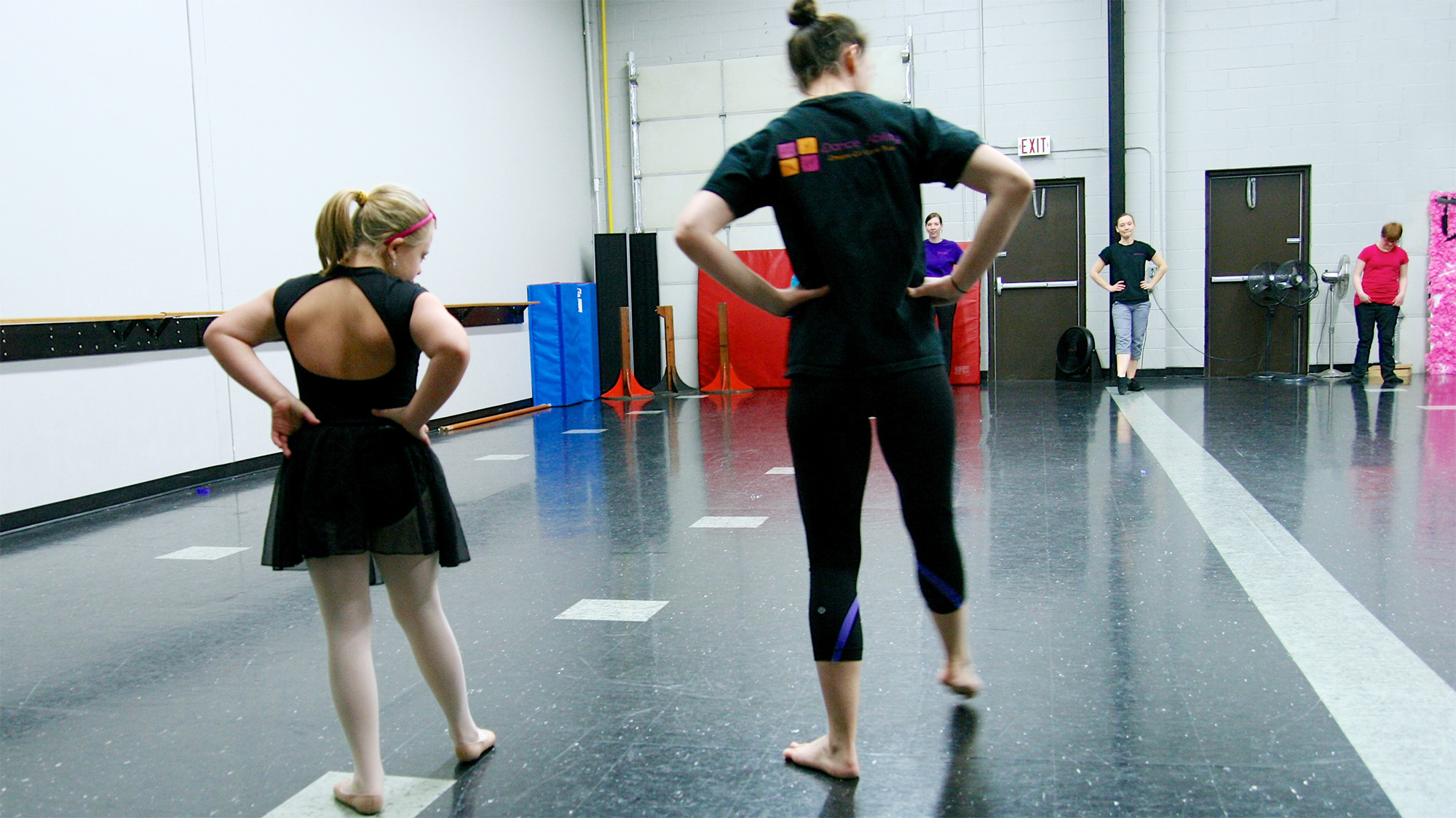 rear shot of two dancers practicing