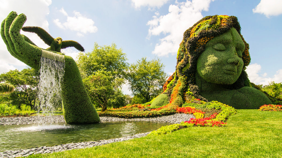 Garden sculpture of woman from foliage