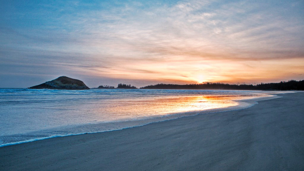 empty white sand beach at sunrise