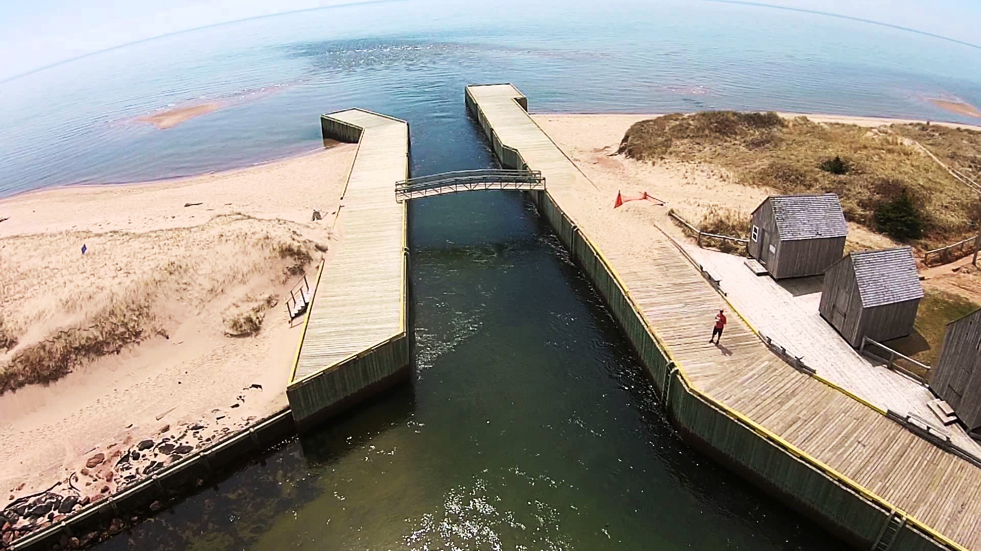 birds eye view of basin head boardwalk along shoreline with bridge