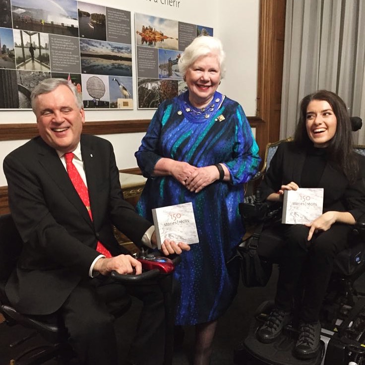 Maayan ziv, left, Jodi Kovitz, right, pose with a cheque for AccessNow.