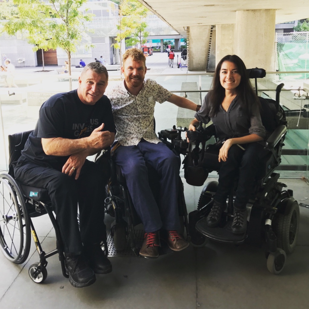 rick hansen, left, luke anderson middle, and maayan ziv, right, pose for photo together