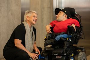 two inter-abled people laughing