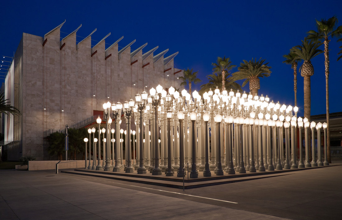 exterior image of lacma lights a night, dozens of streetlamps all together