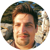 portrait of matthew tenney with his dog in the background