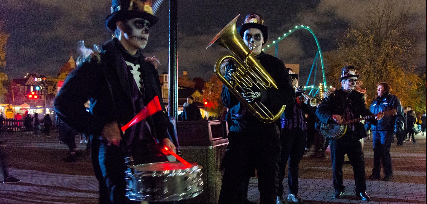 Dixieland Zombie Marching Band members pose with instruments 