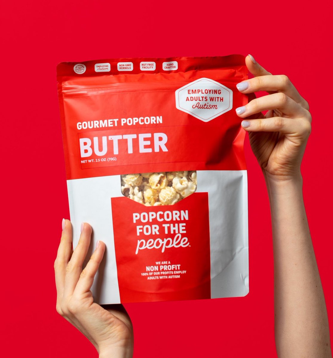 Bag of popcorn. Text on it reads, "Popcorn for the peple. Gourmet Popcorn. Employing Adults with Autism"