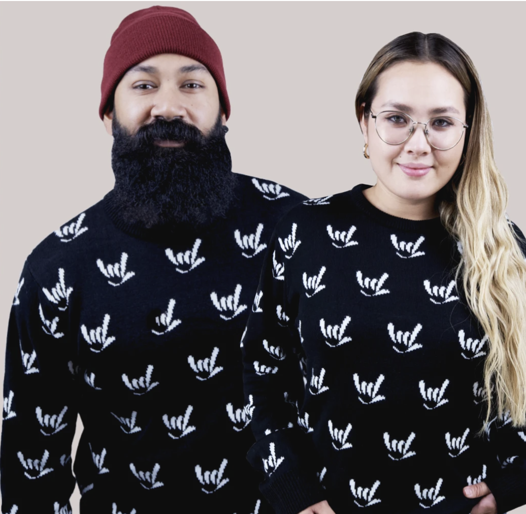 two hipsters wearing sweatshirts with the i love you sign language symbol printed on them