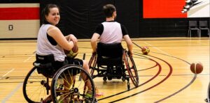 image of two wheelchair basketball players on the court