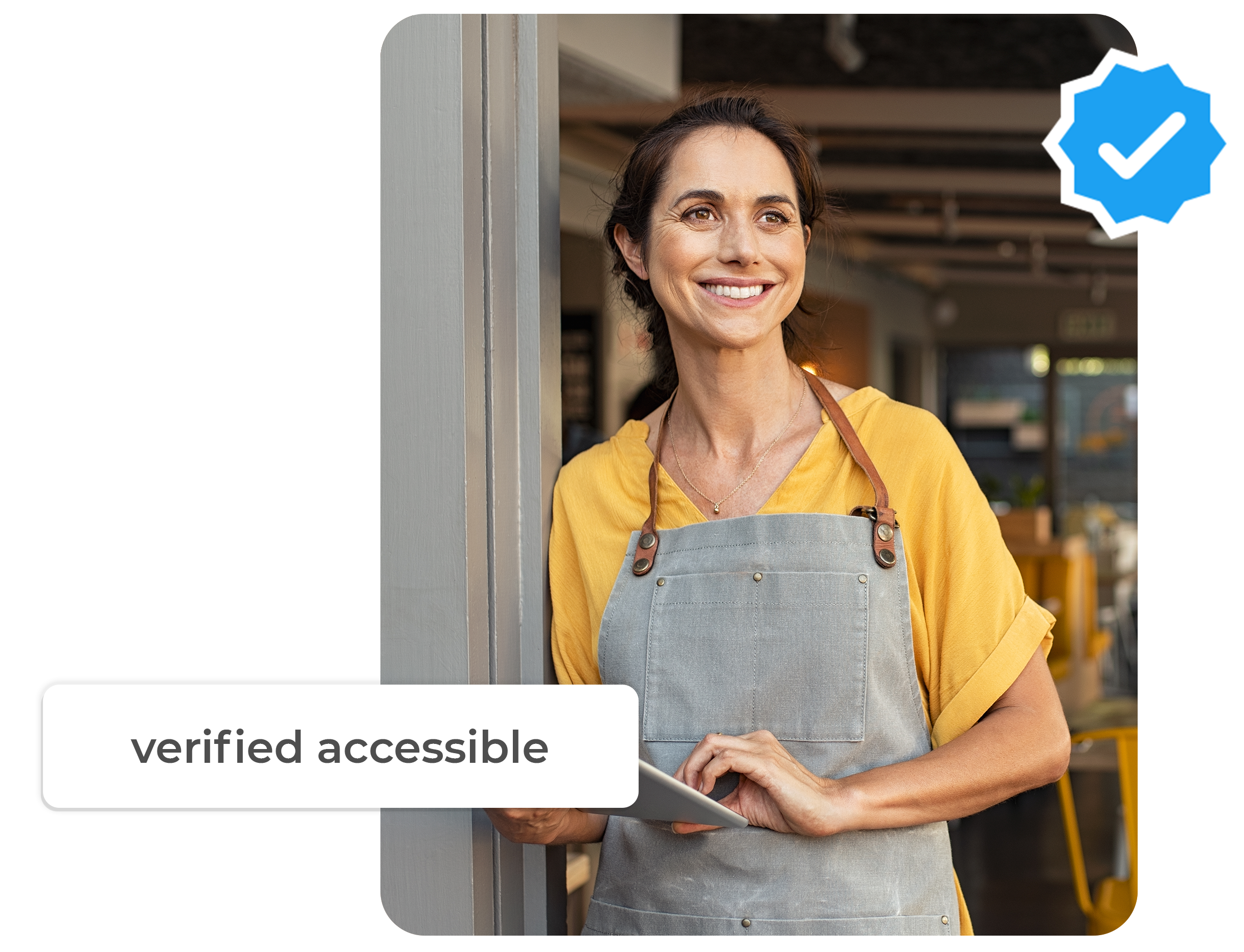 a latin cafe owner stands at the doorway smiling in her apron