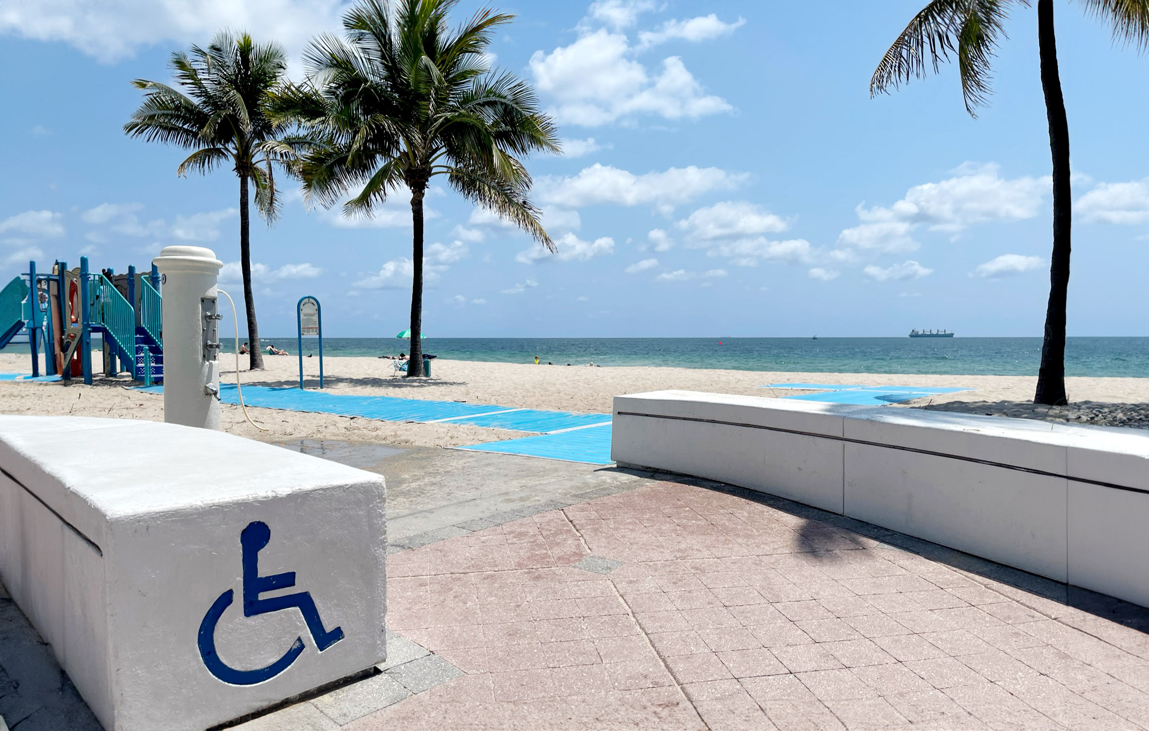 image of wheelchair entrance at beach with mobi mat