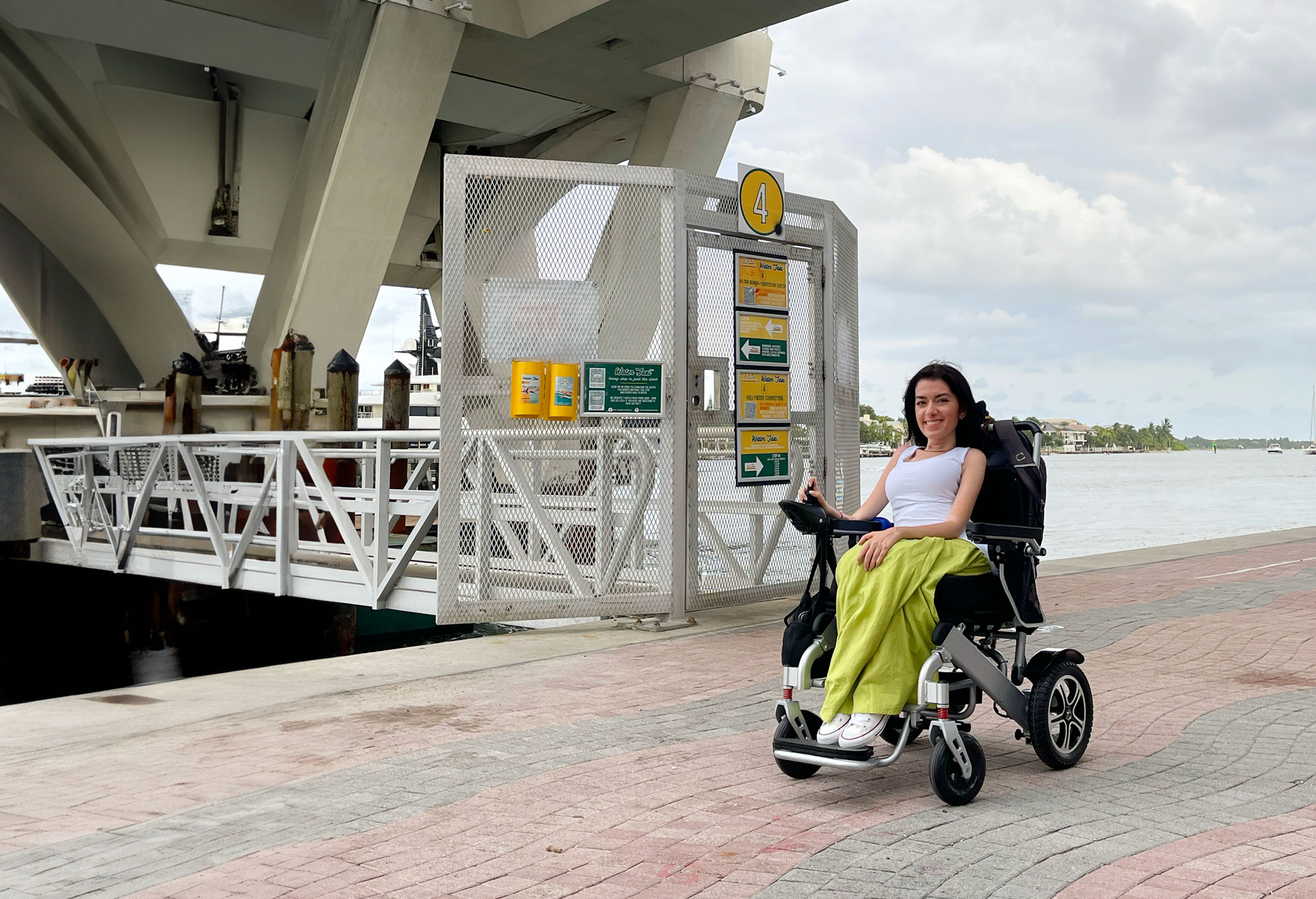 maayan in her wheelchair at stop 4 water taxi bridge by the ocean