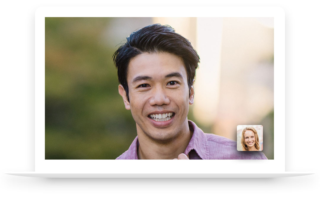 Laptop screen with two Young people having a virtual meeting