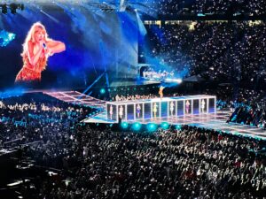 taylor swift on stage at a stadium