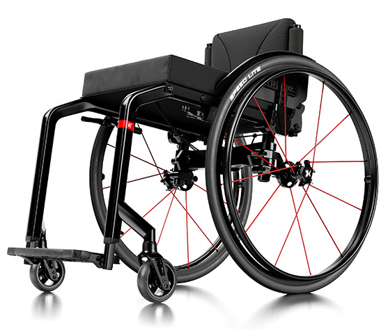 The Küschall Champion wheelchair. This is a black wheelchair with red accents all around.