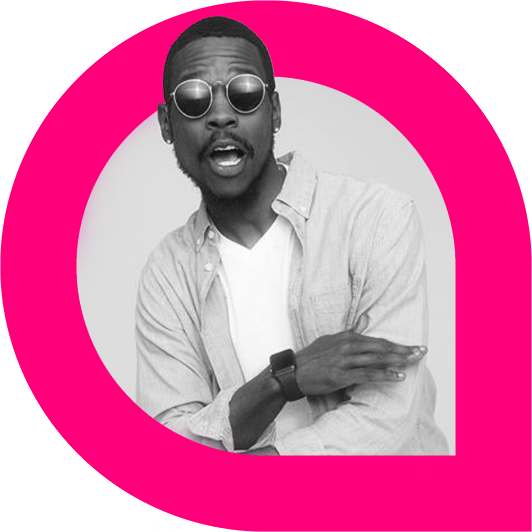 Matt Maxey, a Black man wearing sunglasses, a light button-up shirt over a white T-shirt, and a smartwatch, poses expressively with one arm crossed. The black and white photo is framed within a bold pink graphic shape