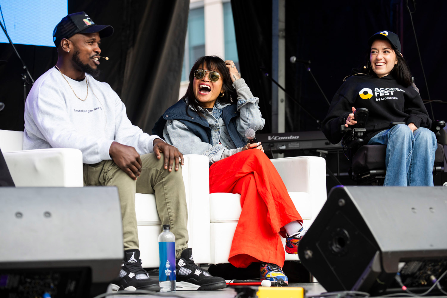 Matt Maxey, Mara Hutchinson, and Maayan Ziv all laughing and on stage at AccessFest 2025. 