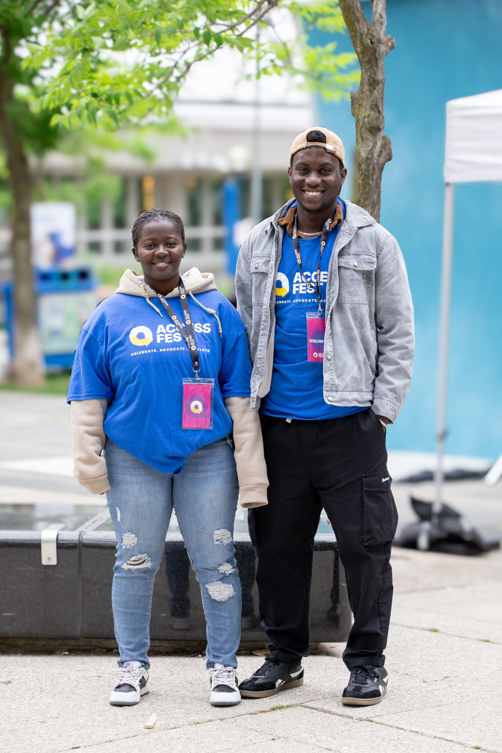Two of our lovely AccessFest volunteers standing side by side, smiling for a photo.