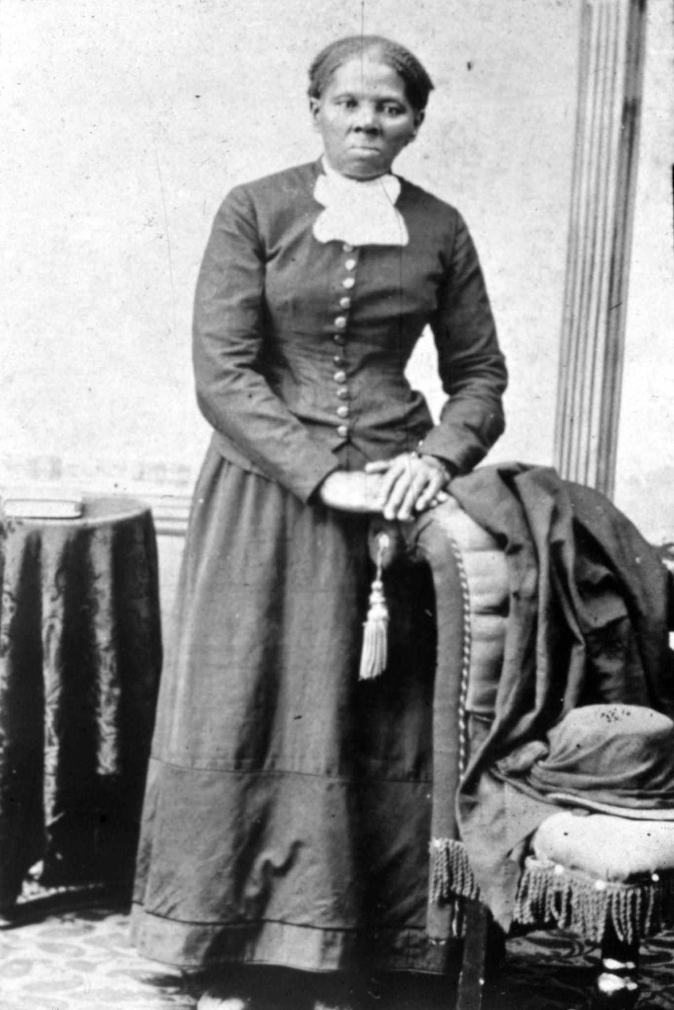 Black and white photo of Harriet Tubman, wearing a long dress.