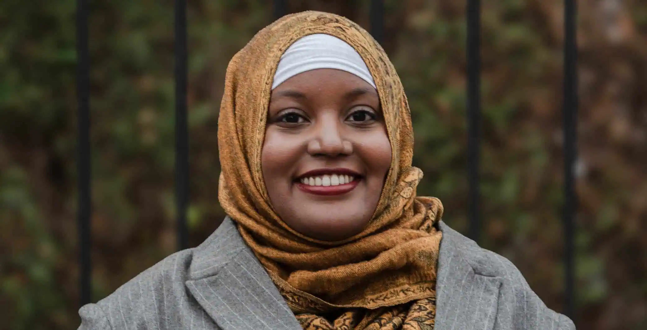 sarah jama wearing a blue hijab