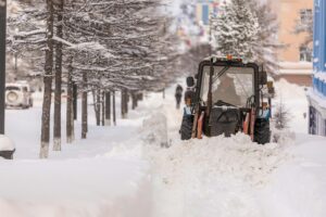 Snowplow Clearing Snow from Urban Street