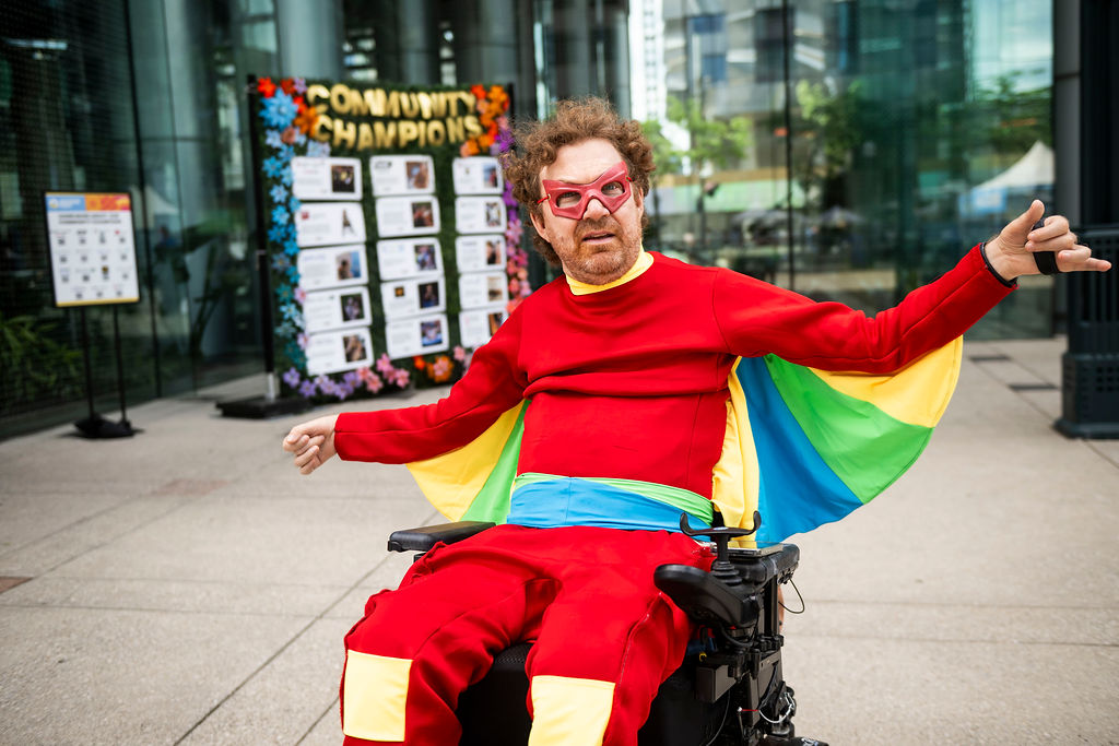 luke anderson in a super hero outfit in his wheelchair 